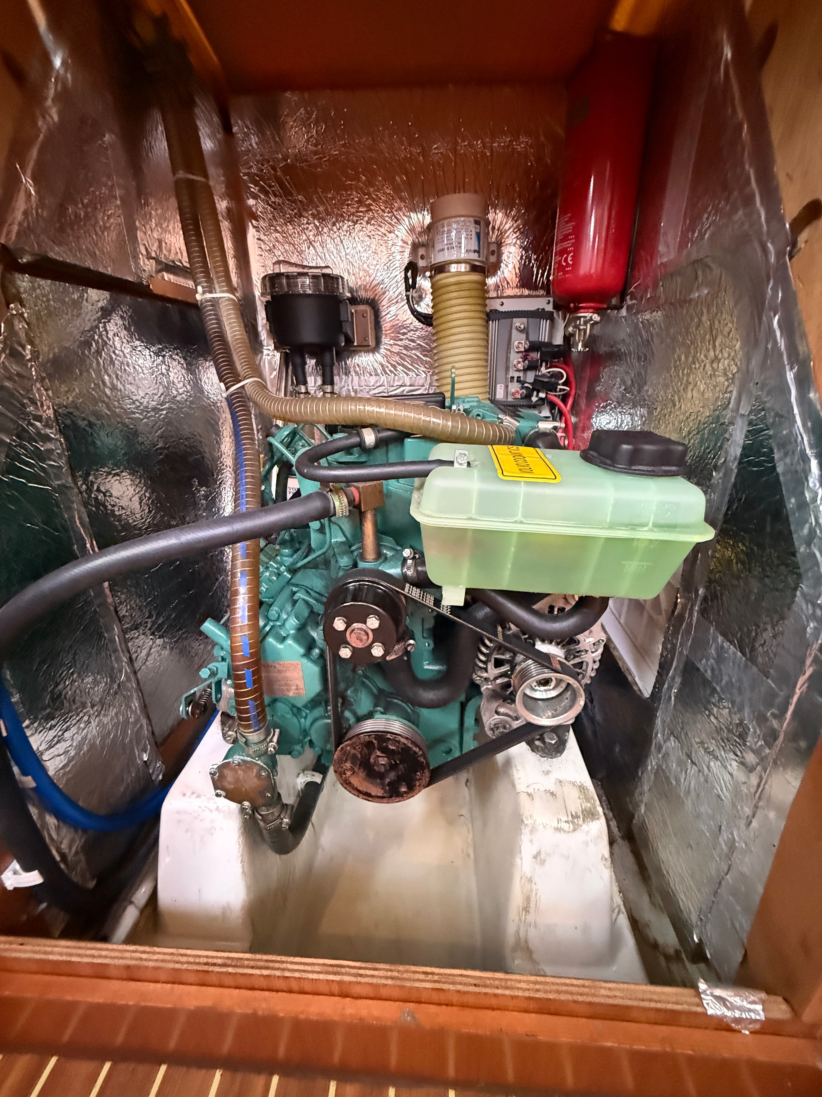 Volvo Penta engine bay — clean installation, fire extinguisher