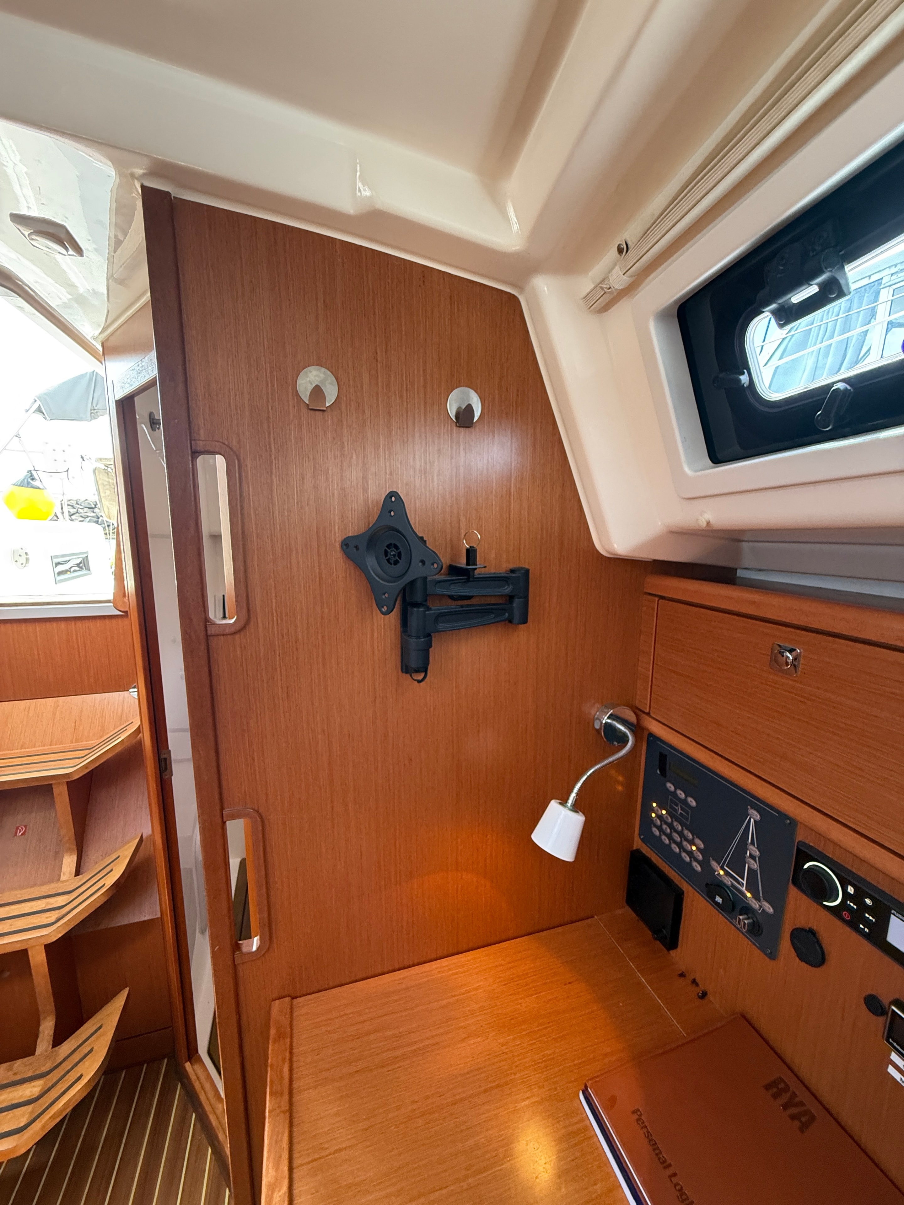 Nav station — TV bracket, Fusion stereo, AIS/DSC panel, RYA chart