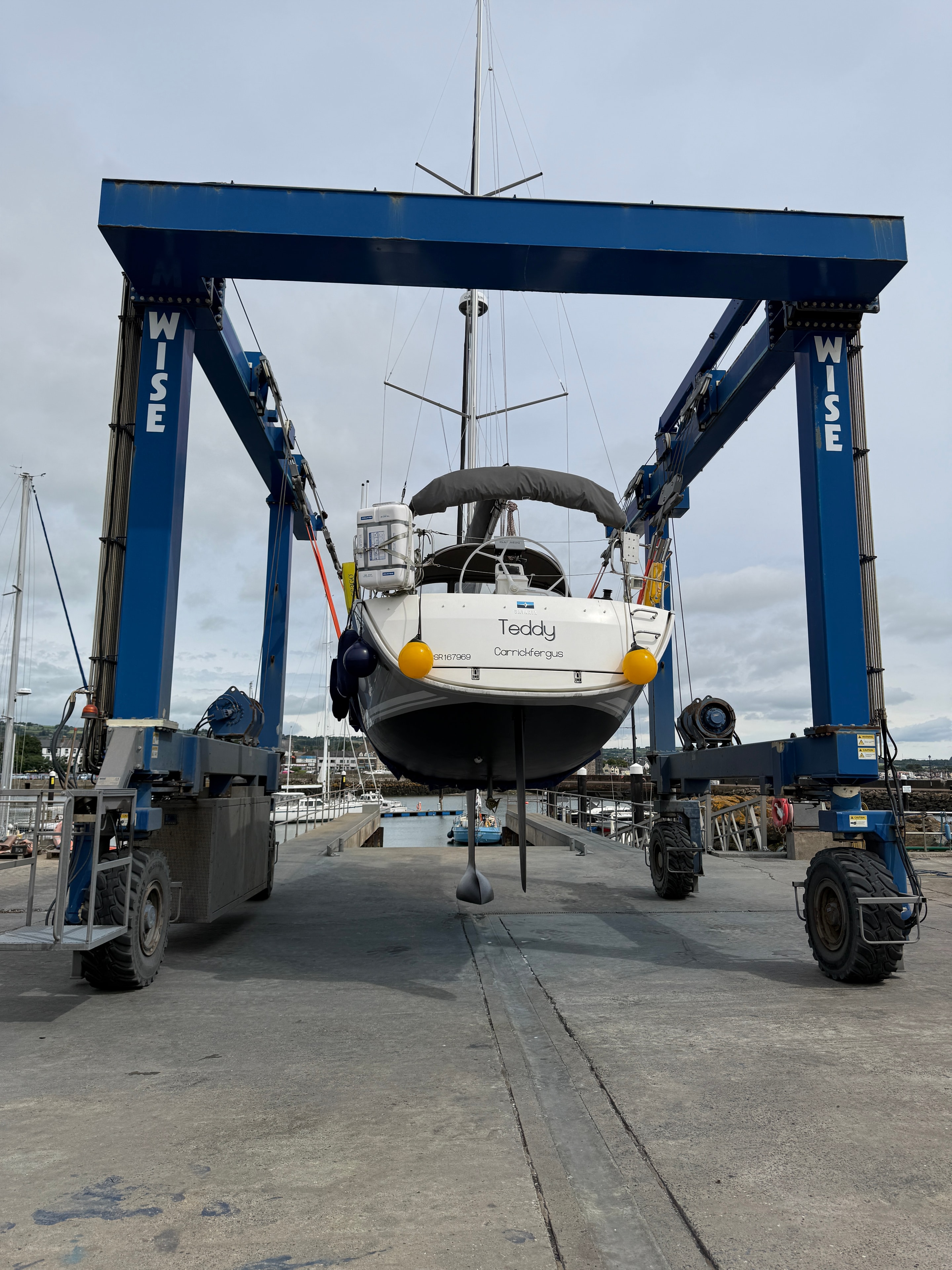 Teddy in travel hoist — stern view, Teddy / Carrickfergus transom, July 2026