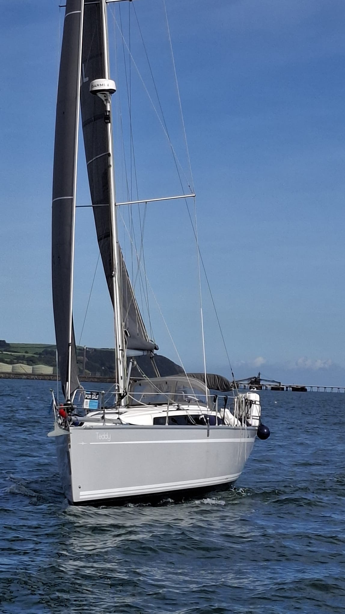 Teddy under sail — port side, name on hull, coastal waters